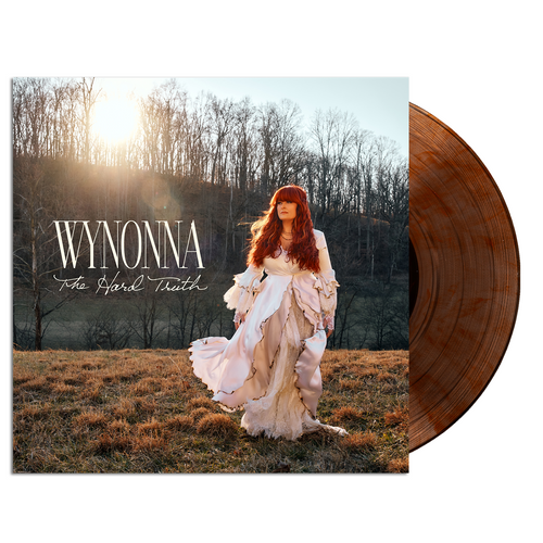 Vinyl record with a cover featuring a woman in a field and the text 'Wynonna The Hard Truth'.